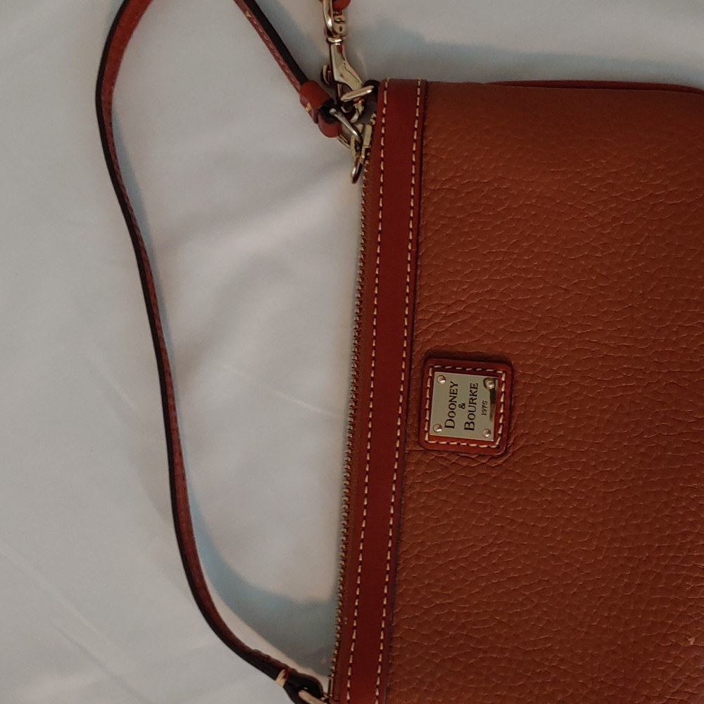 Small on pocket Dooney & Bourke